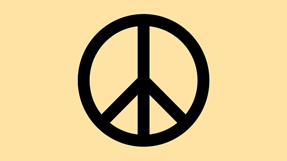 black peace sign on yellow background